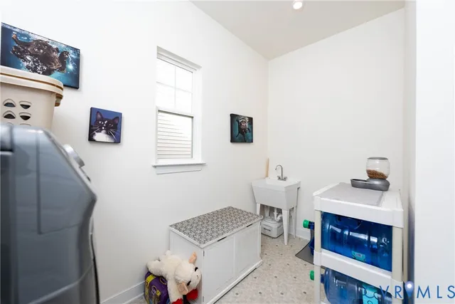 a bathroom with a sink toilet and a mirror