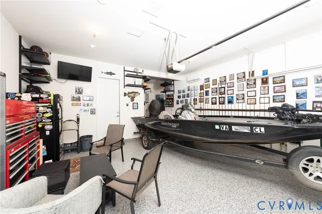 a room with stainless steel appliances kitchen island granite countertop furniture and a kitchen view