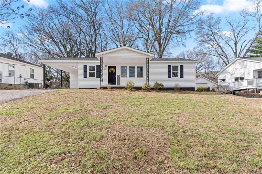 121 Cres Avenue Southwest Rome, GA 30161 - Photo 1 of 1 a front view of a house with a yard