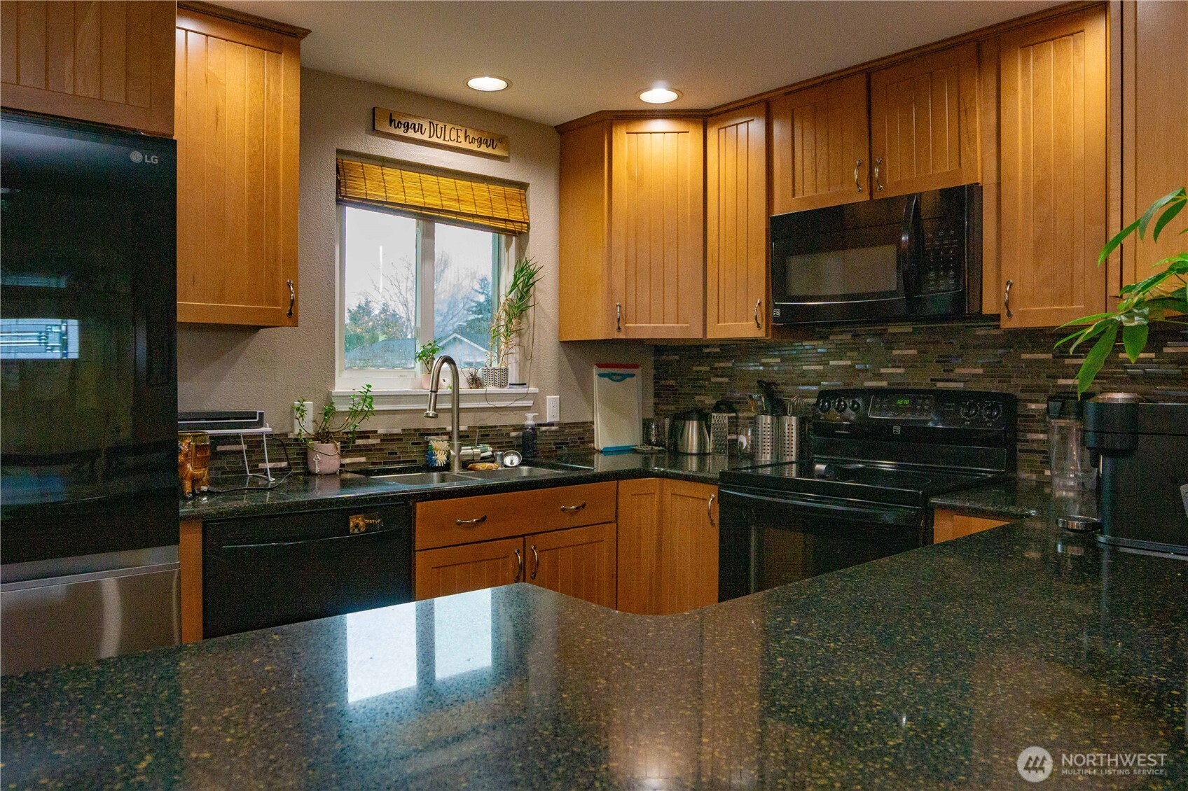 151 Valley View Drive Sequim, WA 98382 - Photo 10 of 40 a kitchen with stainless steel appliances granite countertop a stove a sink and a microwave