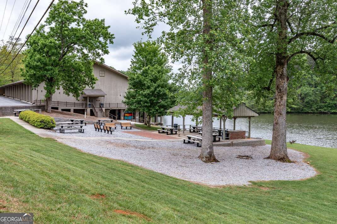 Lot 17 Lower Gap Road, Unit 17 Sautee Nacoochee, GA 30571 - Photo 19 of 39 a front view of a house with garden and sitting area