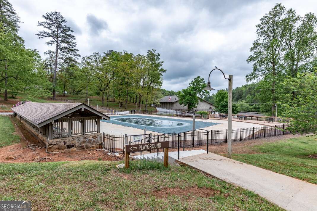 Lot 17 Lower Gap Road, Unit 17 Sautee Nacoochee, GA 30571 - Photo 36 of 39 a view of a house with a yard and sitting area