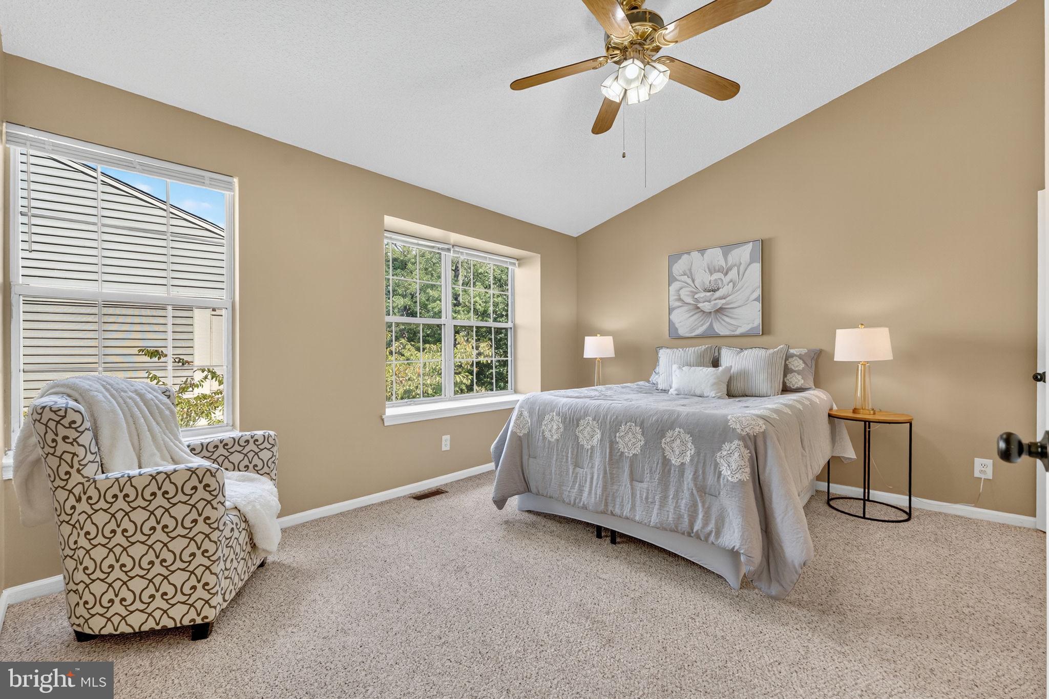 8210 Winstead Place Manassas, VA 20109 - Photo 13 of 27 a bedroom with a bed and a couch