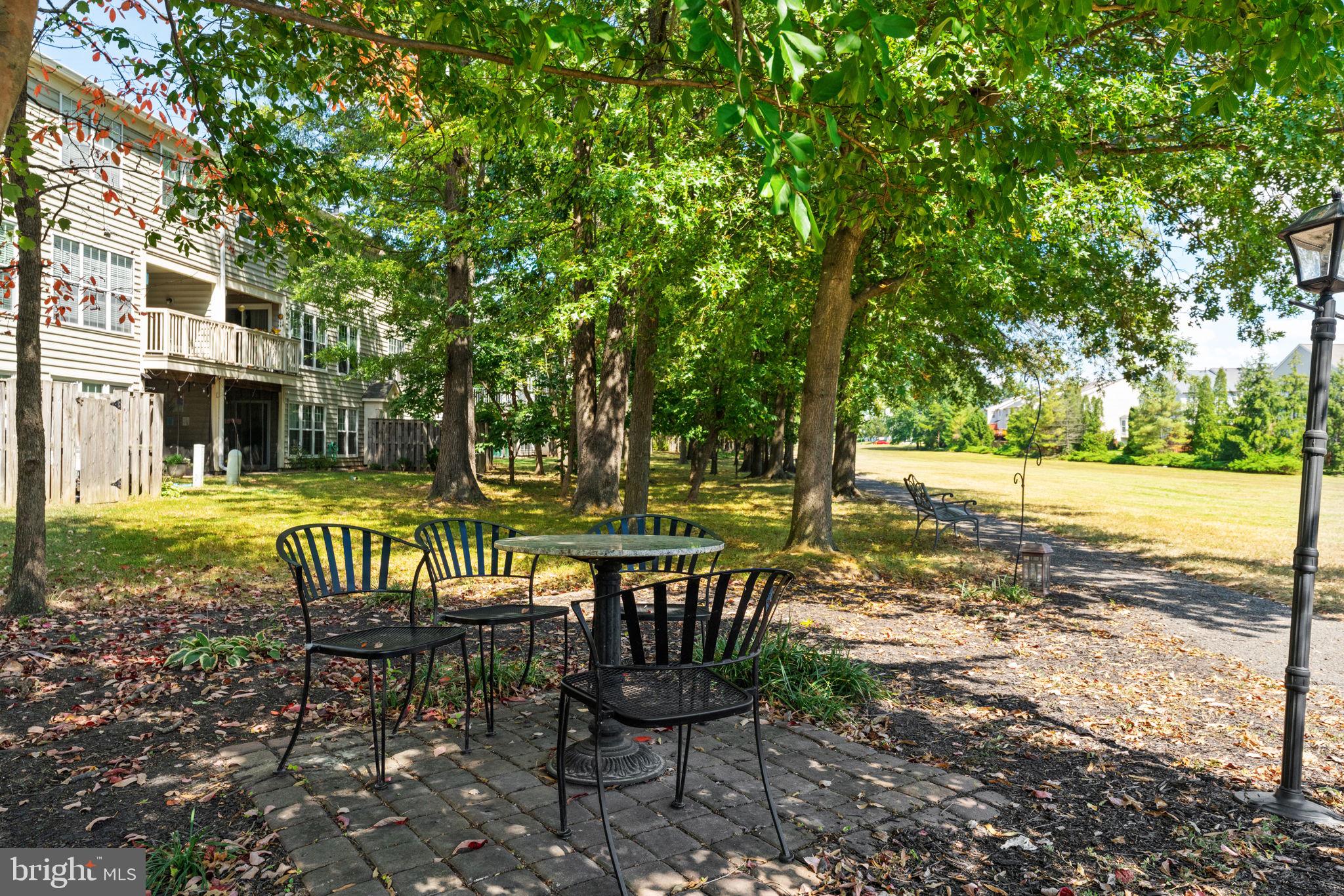 8210 Winstead Place Manassas, VA 20109 - Photo 20 of 27 a view of a chairs and table in backyard