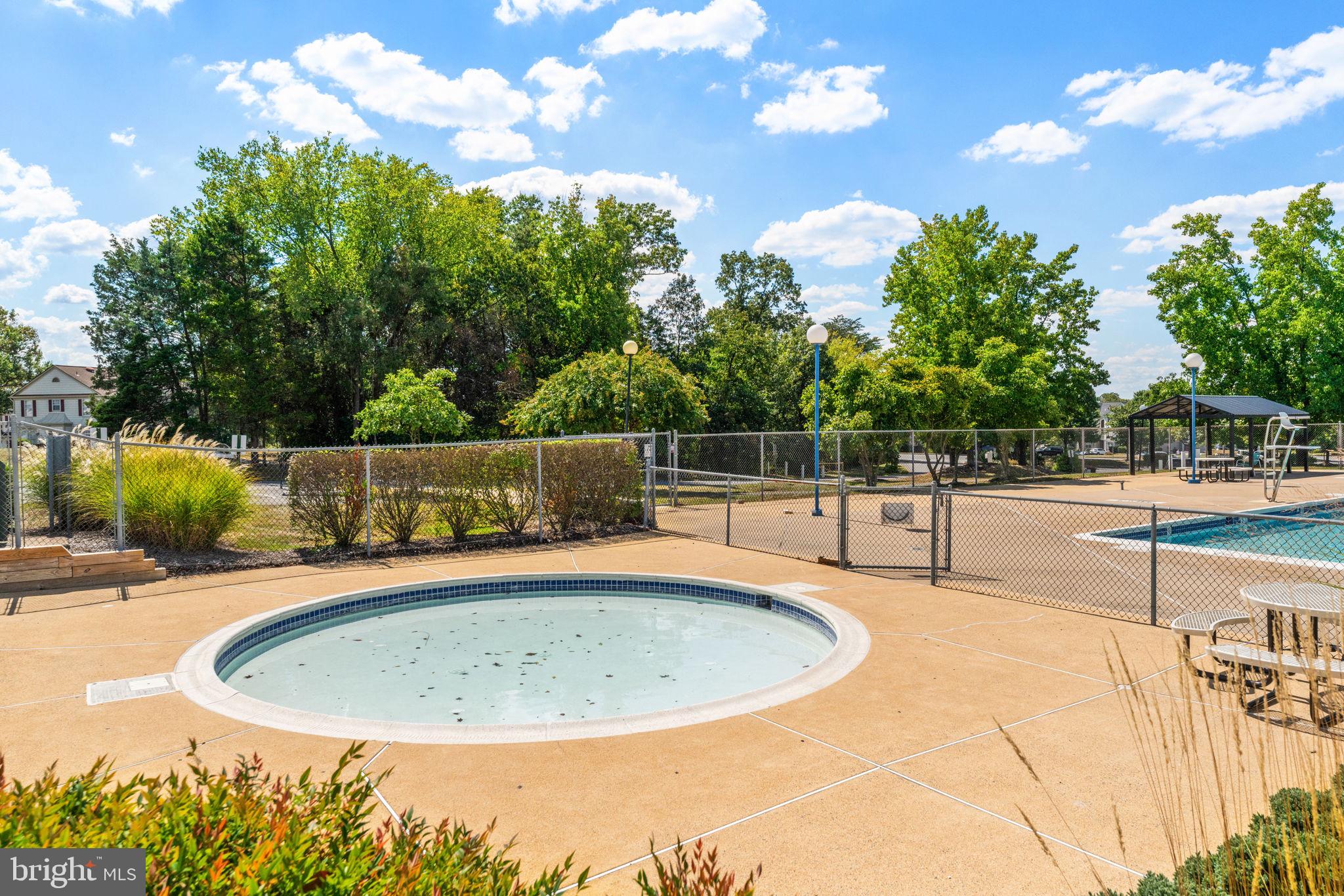 8210 Winstead Place Manassas, VA 20109 - Photo 24 of 27 a small pool with some trees in the background
