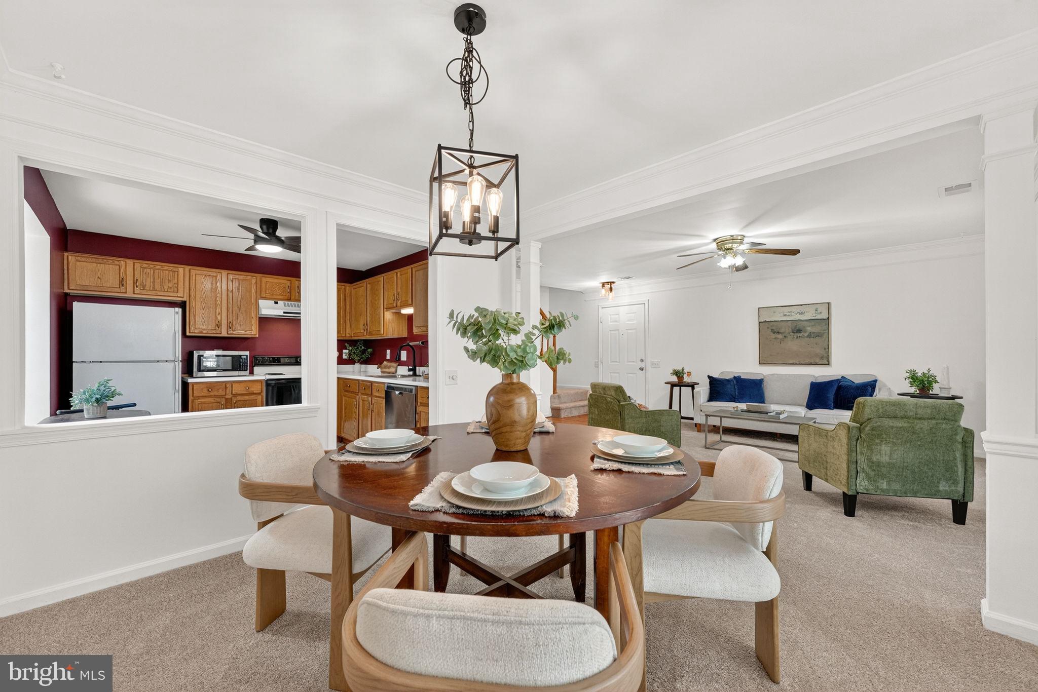 8210 Winstead Place Manassas, VA 20109 - Photo 7 of 27 a dining room with furniture a chandelier and window