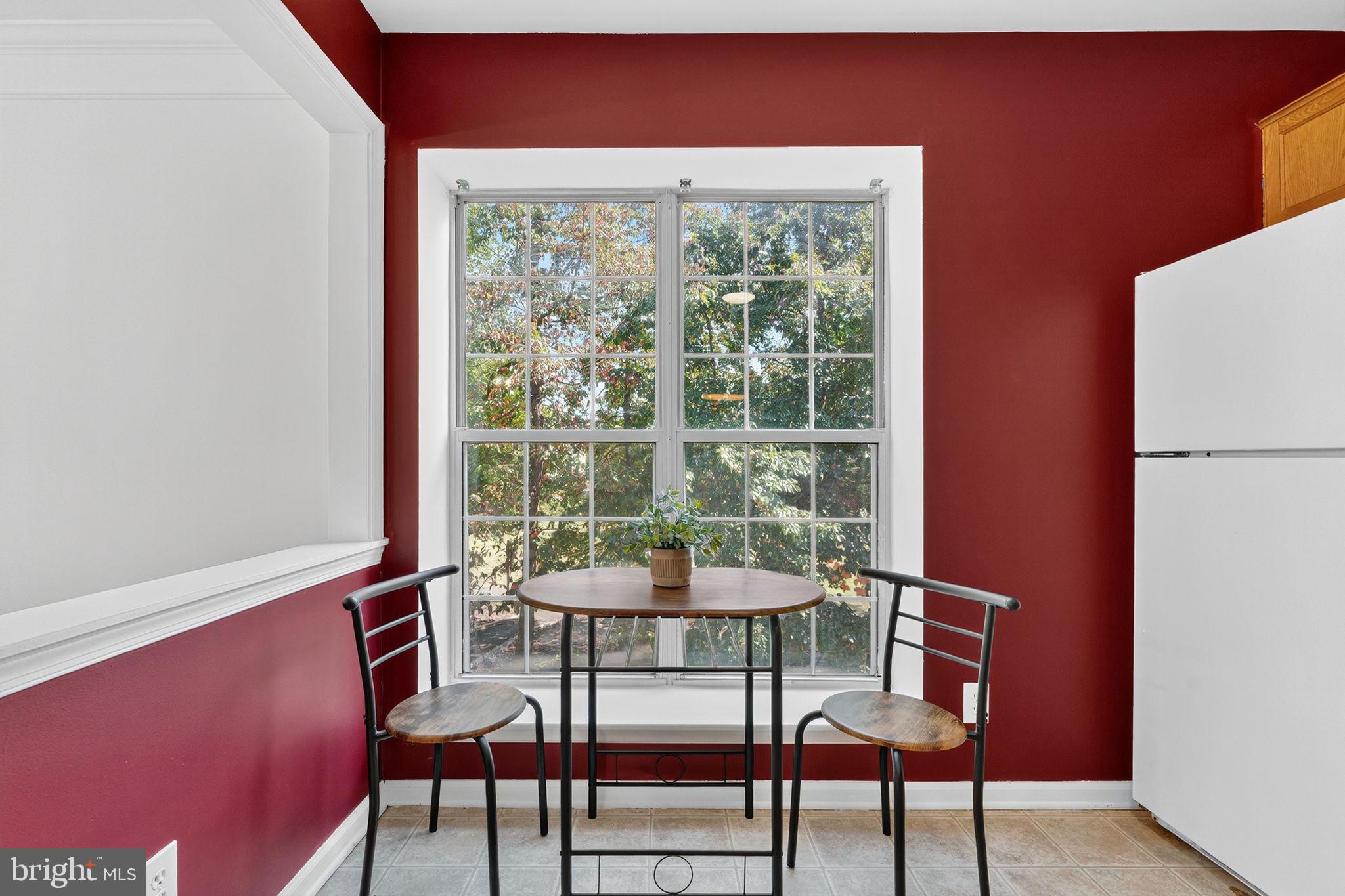8210 Winstead Place Manassas, VA 20109 - Photo 10 of 27 a dining room with furniture and window