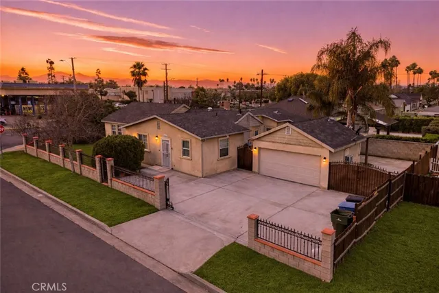 a aerial view of a house with a yard