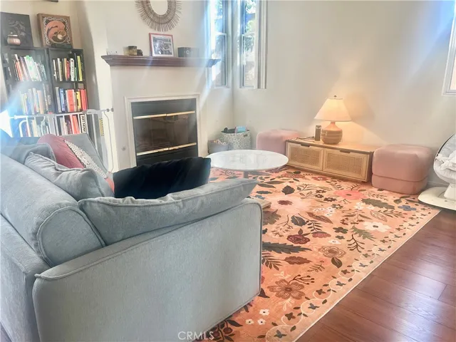 a living room with furniture and a book shelf