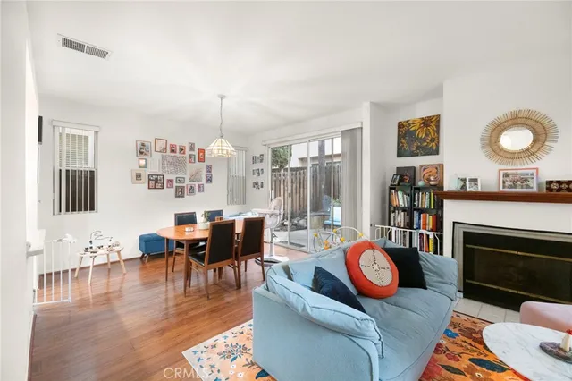 a living room with furniture fireplace and a chandelier