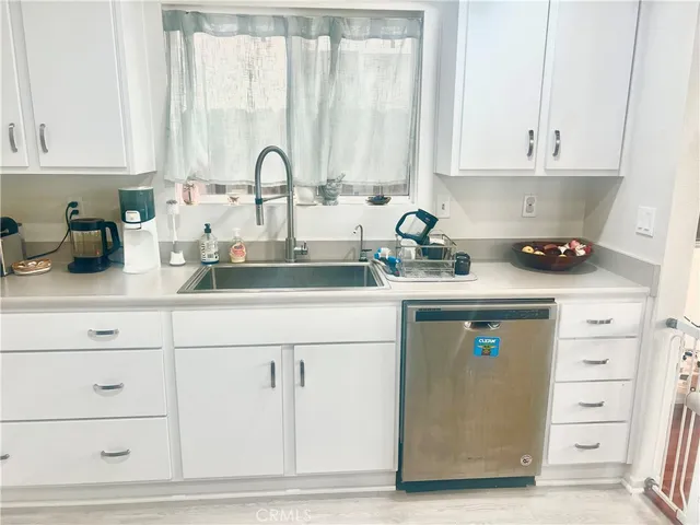 a kitchen with a sink a stove and refrigerator