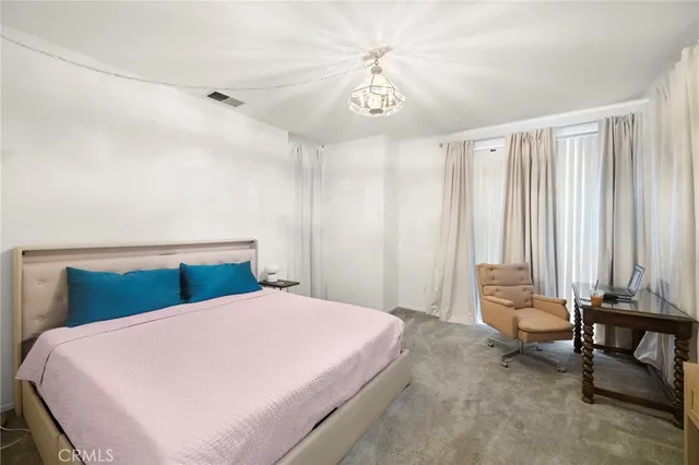 a view of walk in closet with clothes