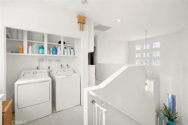 a view of backyard with outdoor seating and plants