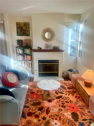 a living room with a couch and a fireplace
