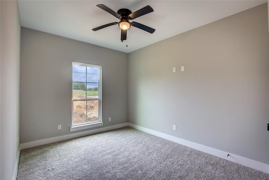 405 Door Key Ranch Road Trinidad, TX 75163 - Photo 14 of 28 Unfurnished room featuring carpet flooring and ceiling fan