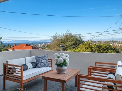 a outdoor living space with furniture and city view