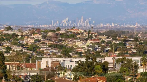 a bedroom with a bed and a chair