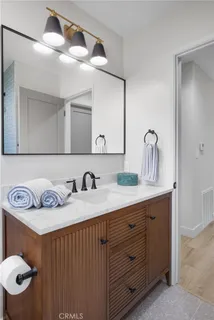 a bed room with a bed and a chair