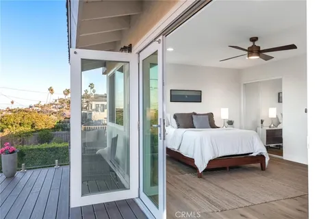 a balcony with view of swimming pool