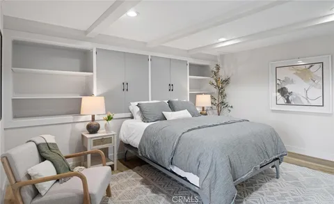 a bedroom with a large bed and a view of bedroom