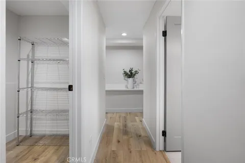 a view of a kitchen with wooden floor