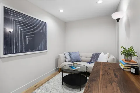 a open kitchen with a refrigerator and a stove