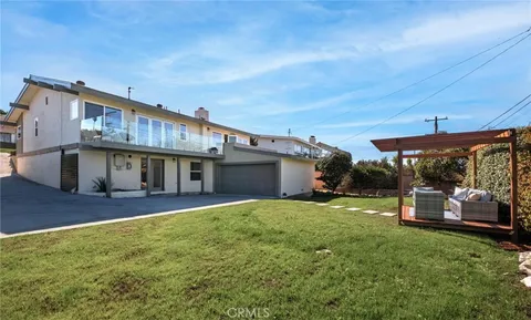 an aerial view of a house with a garden