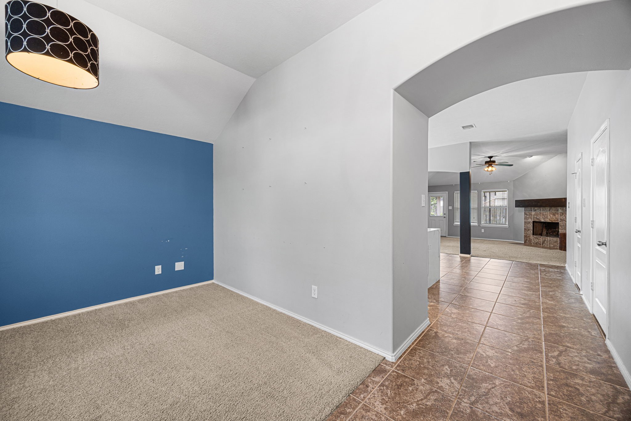 2211 Oak Rise Drive Conroe, TX 77304 - Photo 10 of 29 Room with accent wall opening to hallway