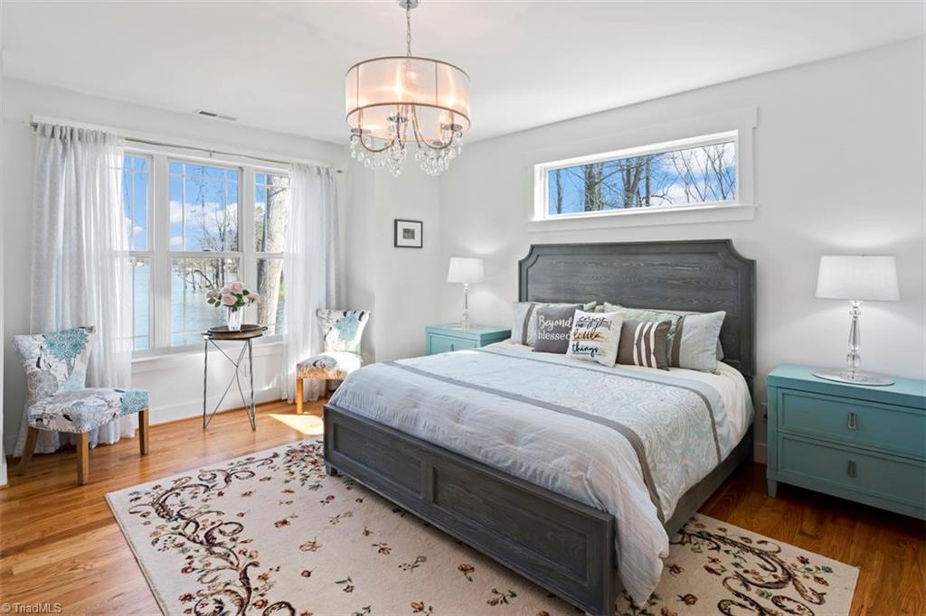 1786 Riverview Road Lexington, NC 27292 - Photo 25 of 50 Primary bedroom walks out to deck overlooking pool and lake