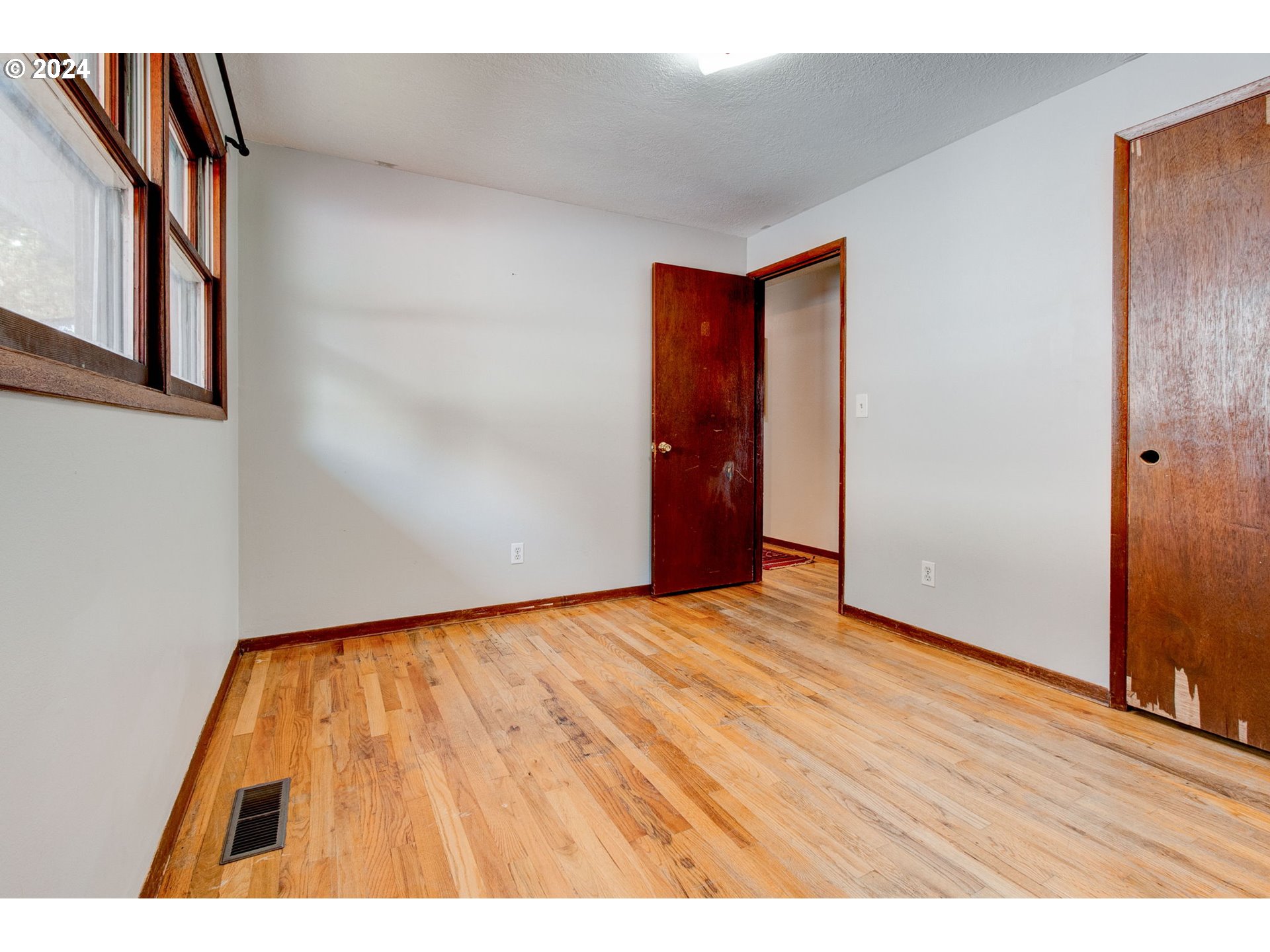 14205 Southeast Salmon Street Portland, OR 97233 - Photo 13 of 35 a view of an empty room and wooden floor