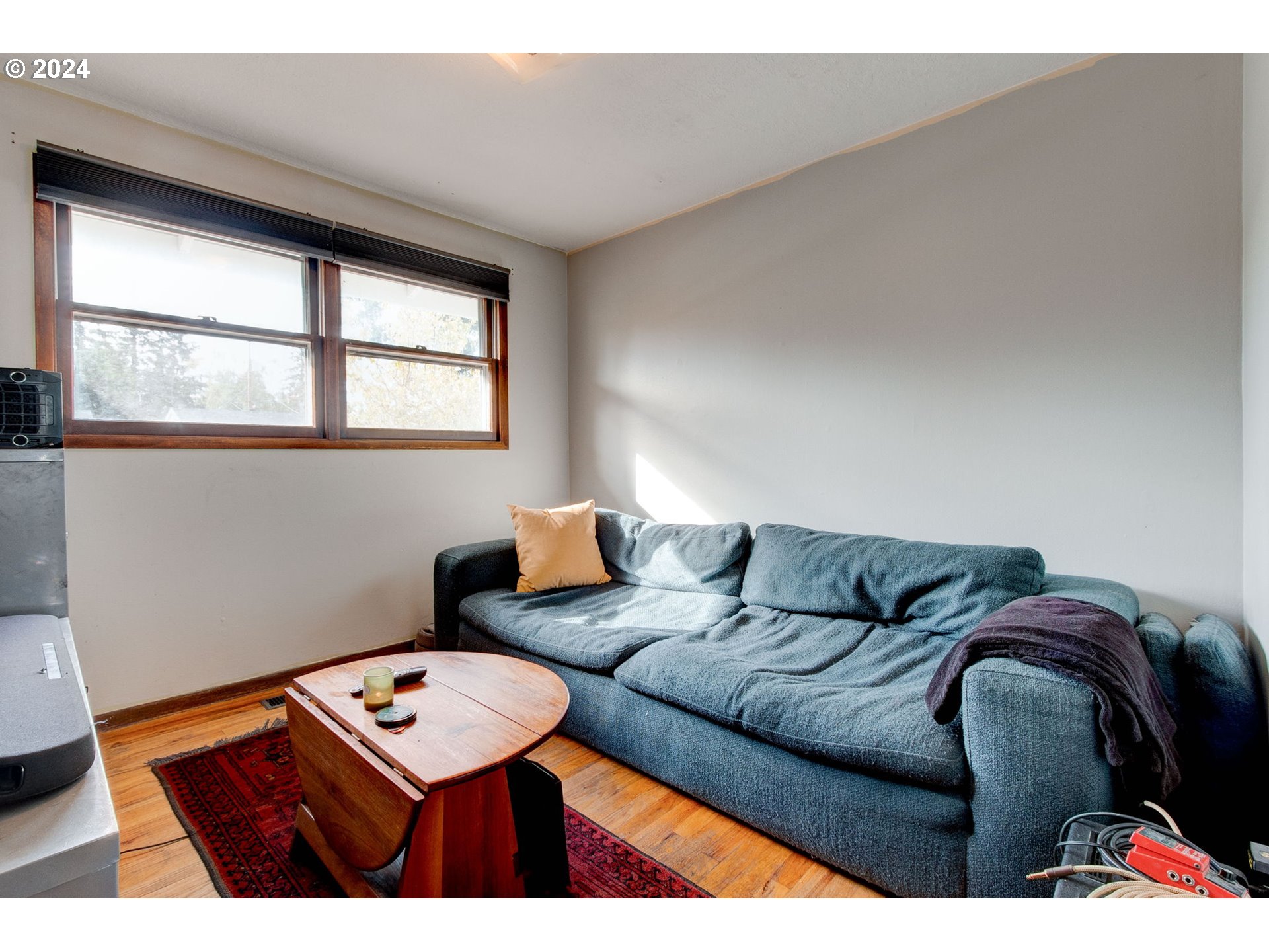 14205 Southeast Salmon Street Portland, OR 97233 - Photo 16 of 35 a living room with furniture and a window