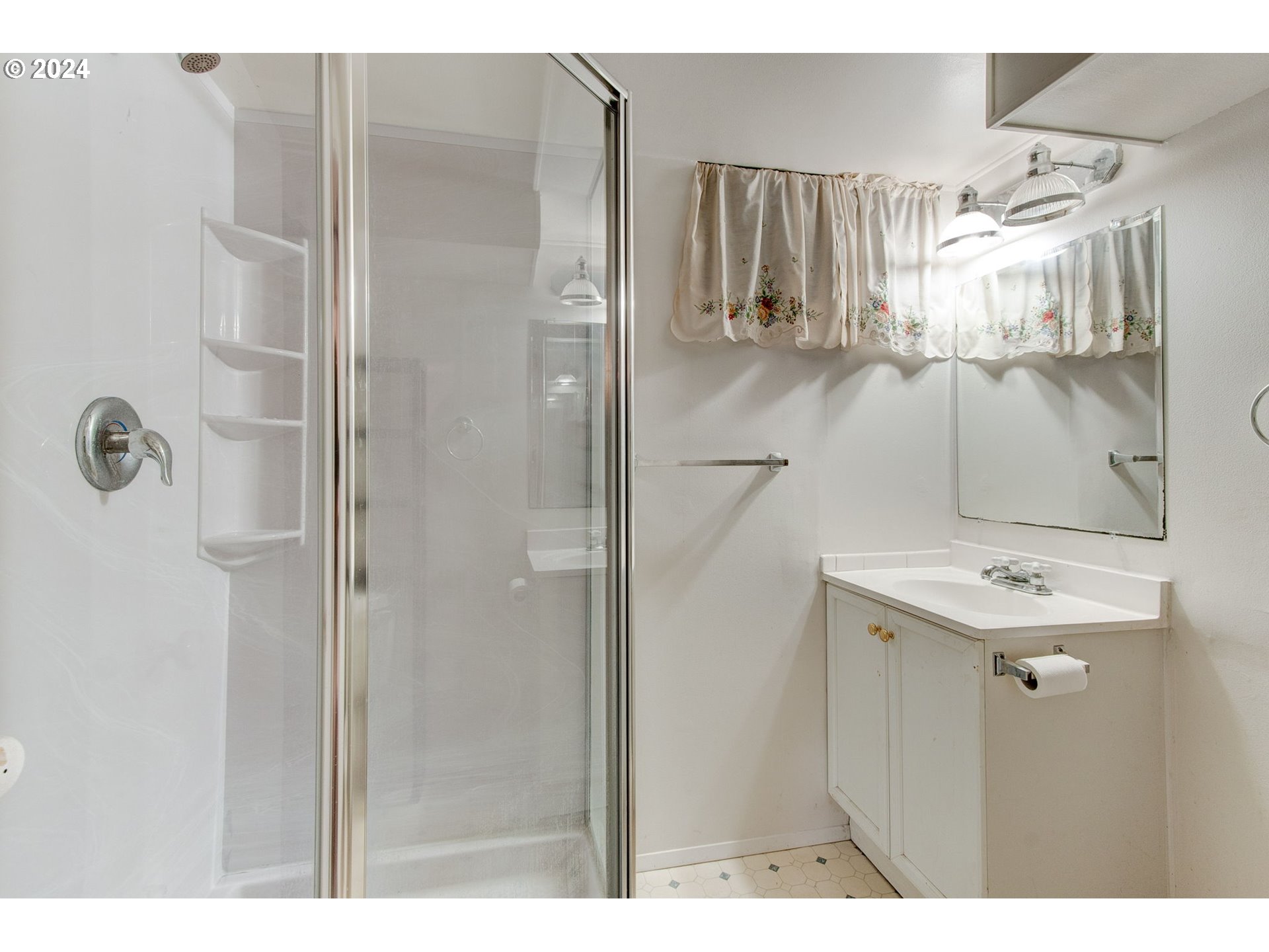 14205 Southeast Salmon Street Portland, OR 97233 - Photo 23 of 35 a bathroom with a sink and mirror
