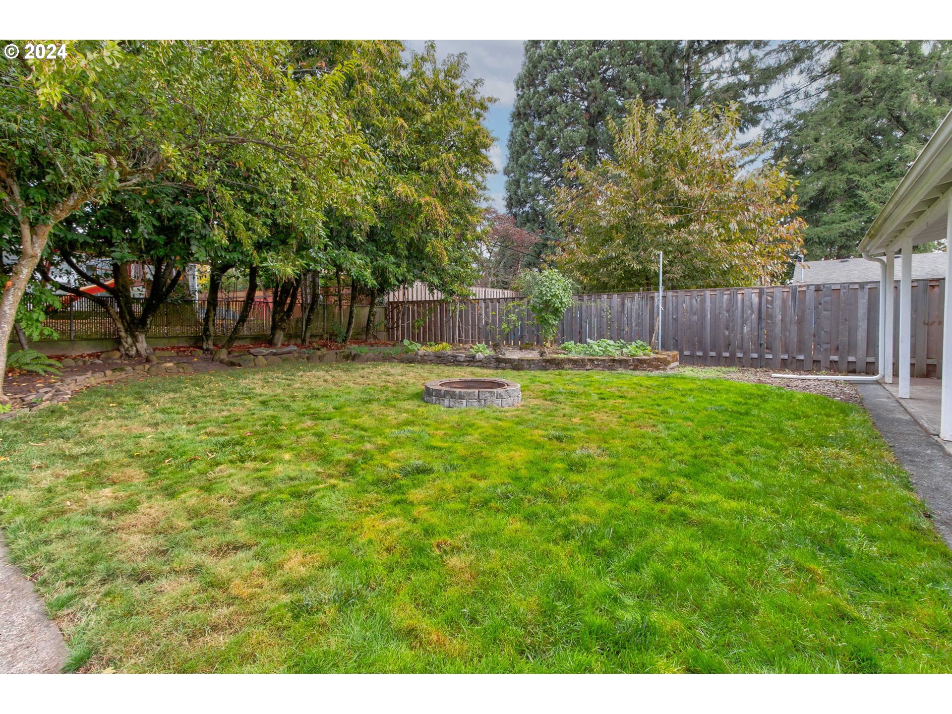 14205 Southeast Salmon Street Portland, OR 97233 - Photo 32 of 35 a swimming pool with wooden fence