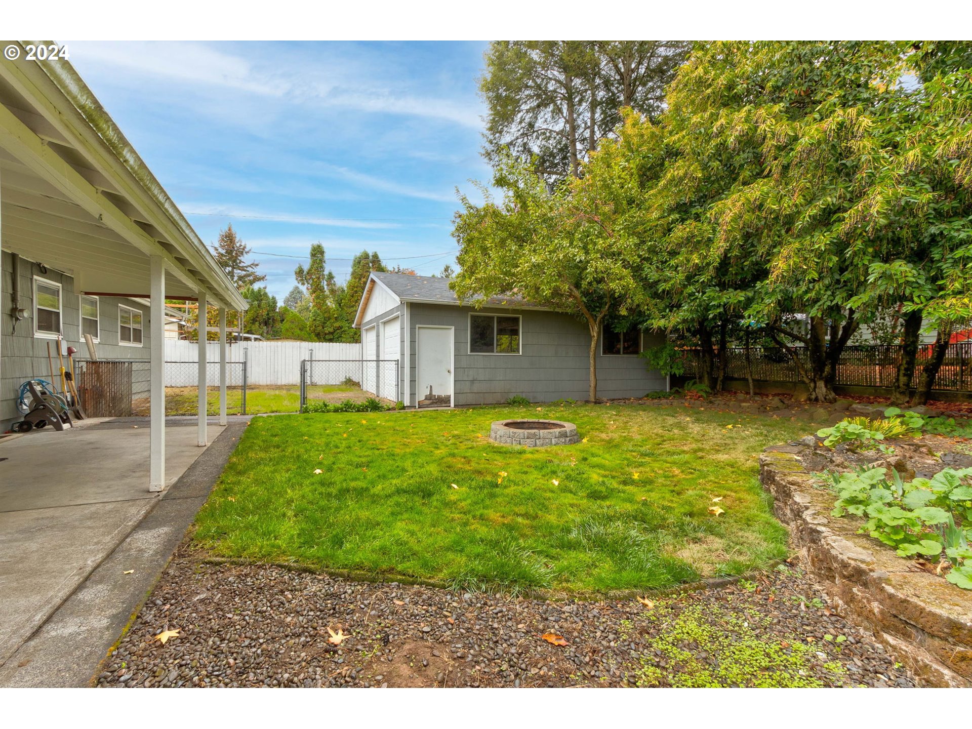 14205 Southeast Salmon Street Portland, OR 97233 - Photo 33 of 35 a front view of a house with a garden