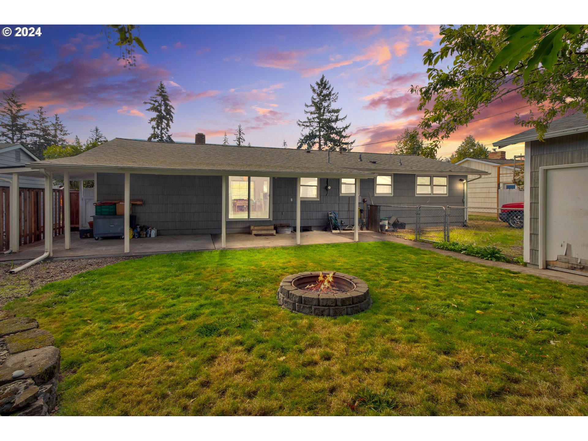 14205 Southeast Salmon Street Portland, OR 97233 - Photo 34 of 35 a front view of a house with a yard and trees