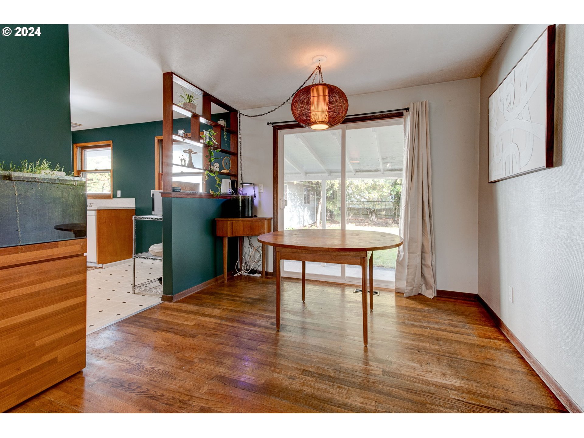14205 Southeast Salmon Street Portland, OR 97233 - Photo 6 of 35 a workspace with furniture window and wooden floor