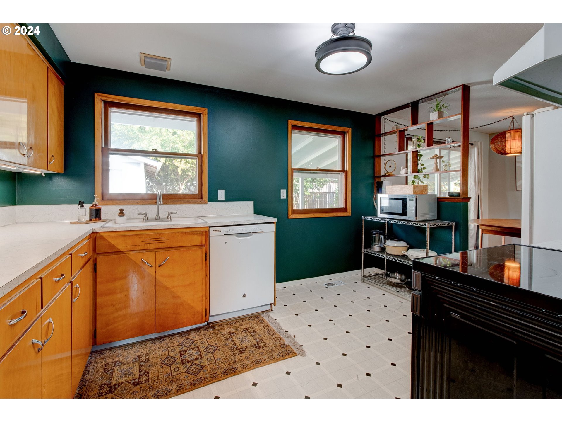 14205 Southeast Salmon Street Portland, OR 97233 - Photo 10 of 35 a kitchen with a sink cabinets and window