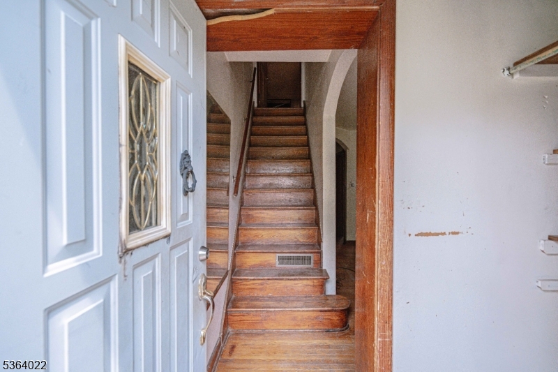 79 Mountain Lake Road Belvidere, NJ 07823 - Photo 16 of 47 a view of a hallway with wooden floor and staircase