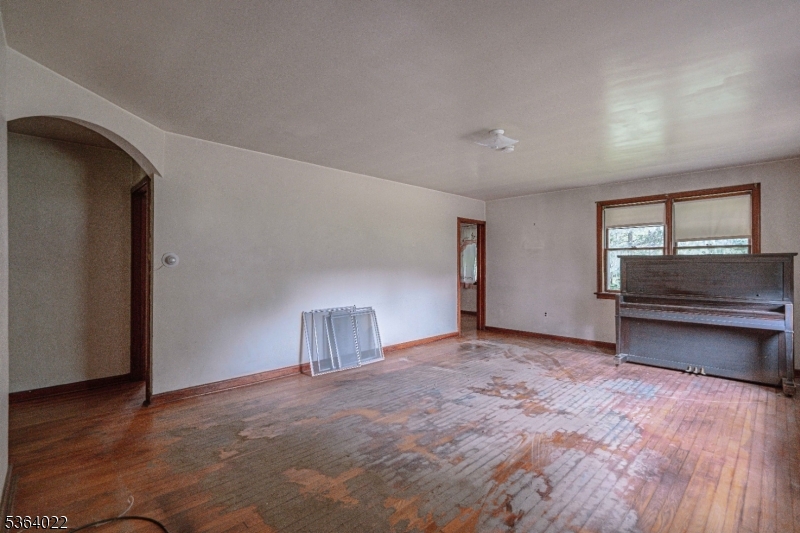 79 Mountain Lake Road Belvidere, NJ 07823 - Photo 18 of 47 a view of an empty room with a window and a kitchen