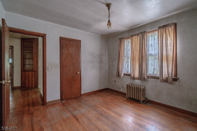 79 Mountain Lake Road Belvidere, NJ 07823 - Photo 29 of 47 a view of an empty room with wooden floor and a window