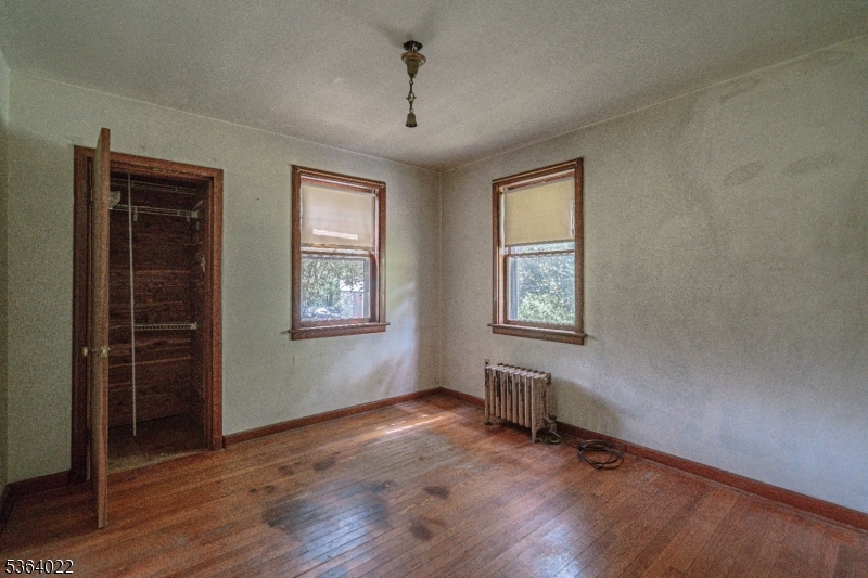 79 Mountain Lake Road Belvidere, NJ 07823 - Photo 31 of 47 a view of an empty room with wooden floor and a window