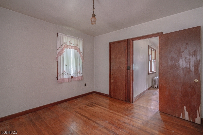 79 Mountain Lake Road Belvidere, NJ 07823 - Photo 33 of 47 a view of empty room with wooden floor and fan