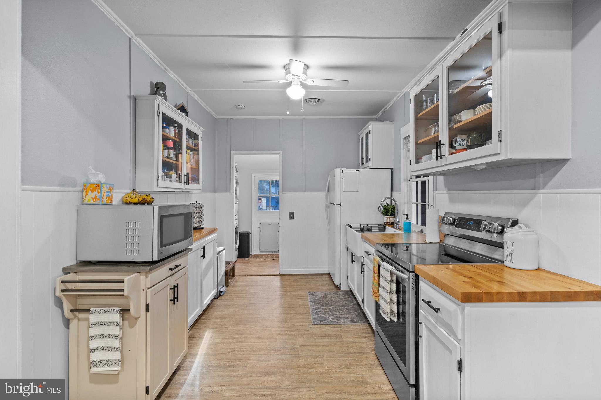 6015 Poplar Road St. Leonard, MD 20685 - Photo 16 of 35 a kitchen with stainless steel appliances granite countertop a refrigerator a stove top oven a sink and dishwasher