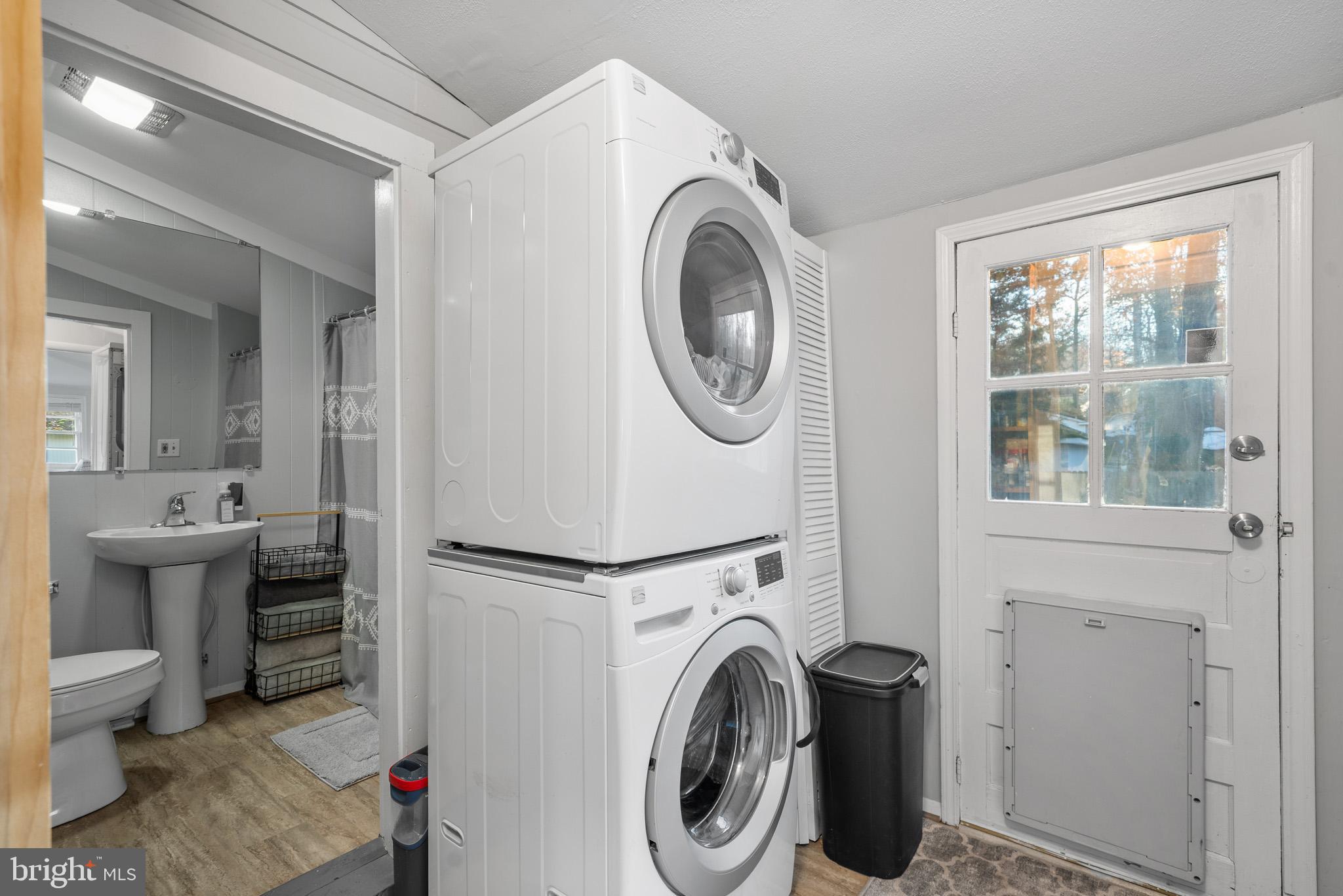 6015 Poplar Road St. Leonard, MD 20685 - Photo 22 of 35 a view of a bathroom with washing machine and sink