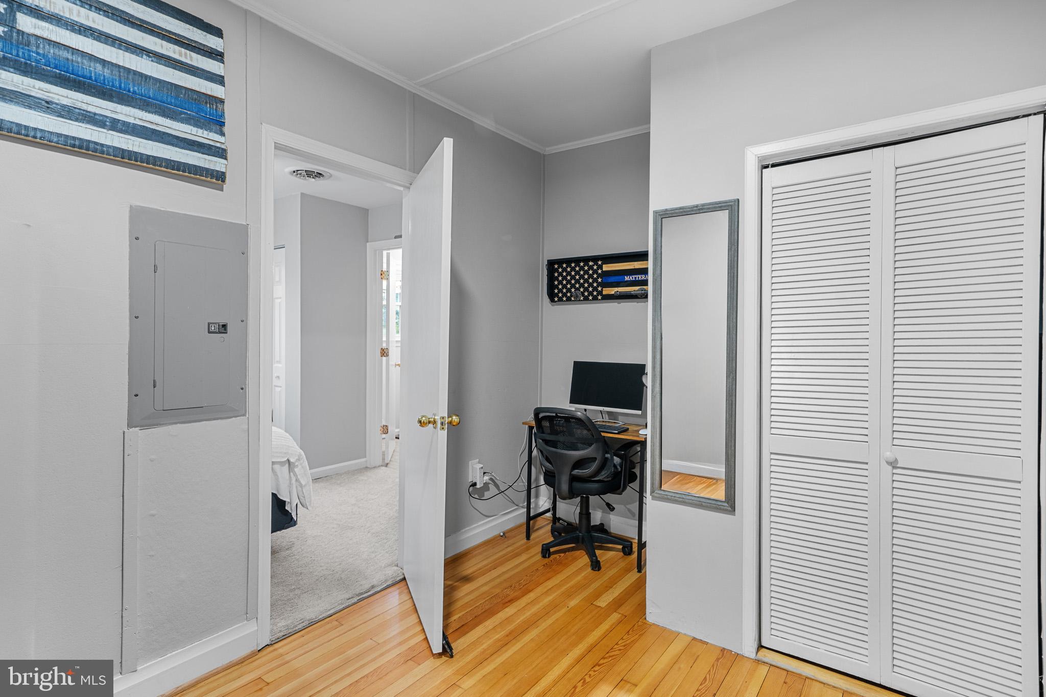 6015 Poplar Road St. Leonard, MD 20685 - Photo 26 of 35 a view of a workspace with wooden floor and a window