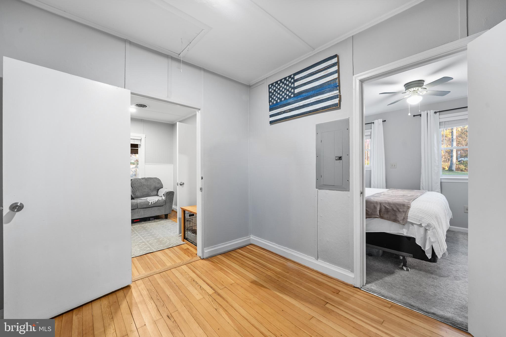 6015 Poplar Road St. Leonard, MD 20685 - Photo 28 of 35 a bedroom with furniture and a wooden floor