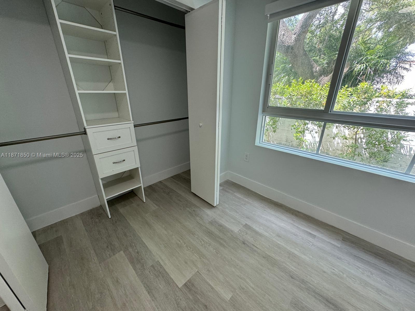 2555 Northeast 193rd Street, Unit 2106 Miami, FL 33180 - Photo 12 of 14 an empty room with windows