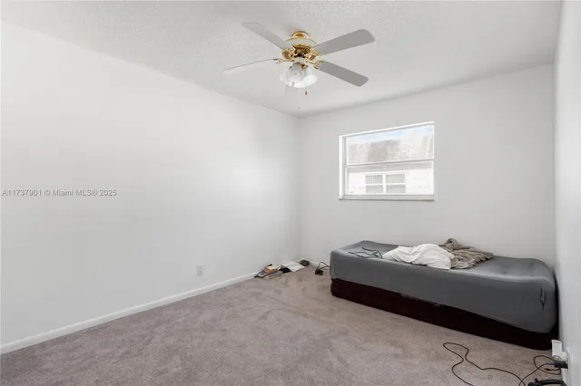 a view of a chairs and table in a balcony