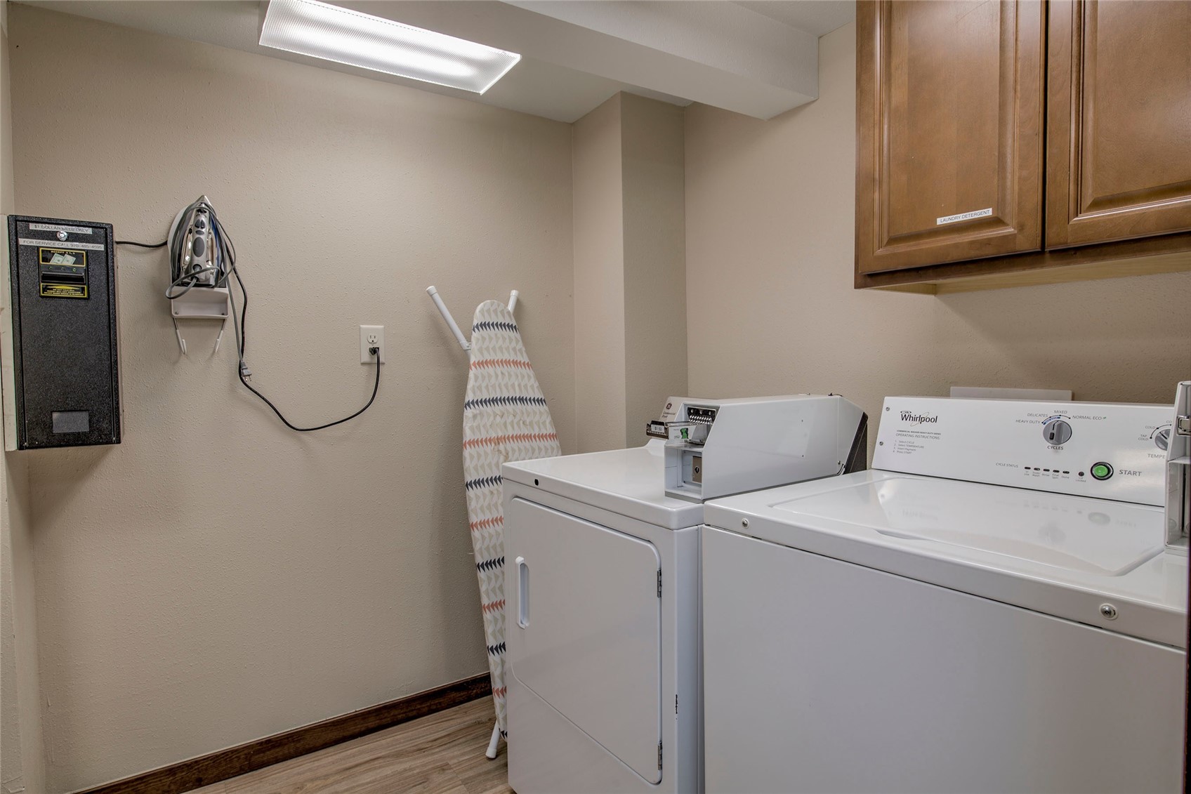 110 Sawmill Road, Unit 7A Breckenridge, CO 80424 - Photo 8 of 27 Laundry area featuring light hardwood / wood-style floors, cabinets, and washer and clothes dryer