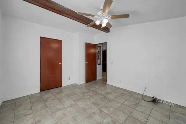 a view of a livingroom with a chandelier fan